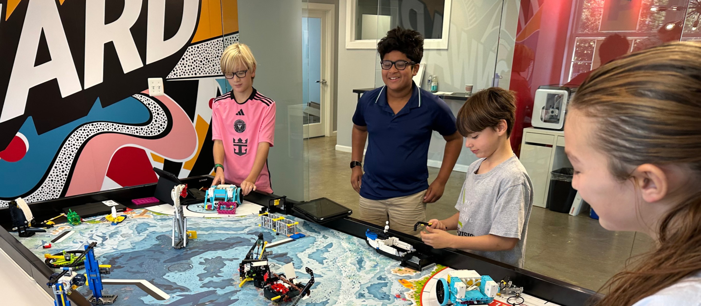 Students working together on a robot build at UP Robotics